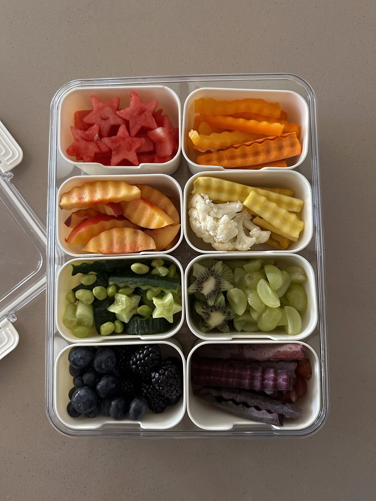 Crinkle cut veggies and star shaped mellons in cute containers.